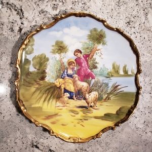 Limoges Large antique plate with 24ktg trim.